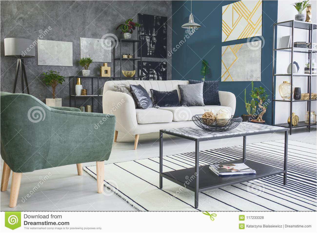 living room interior paintings low angle table striped rug next to green armchair sofa living room interior
